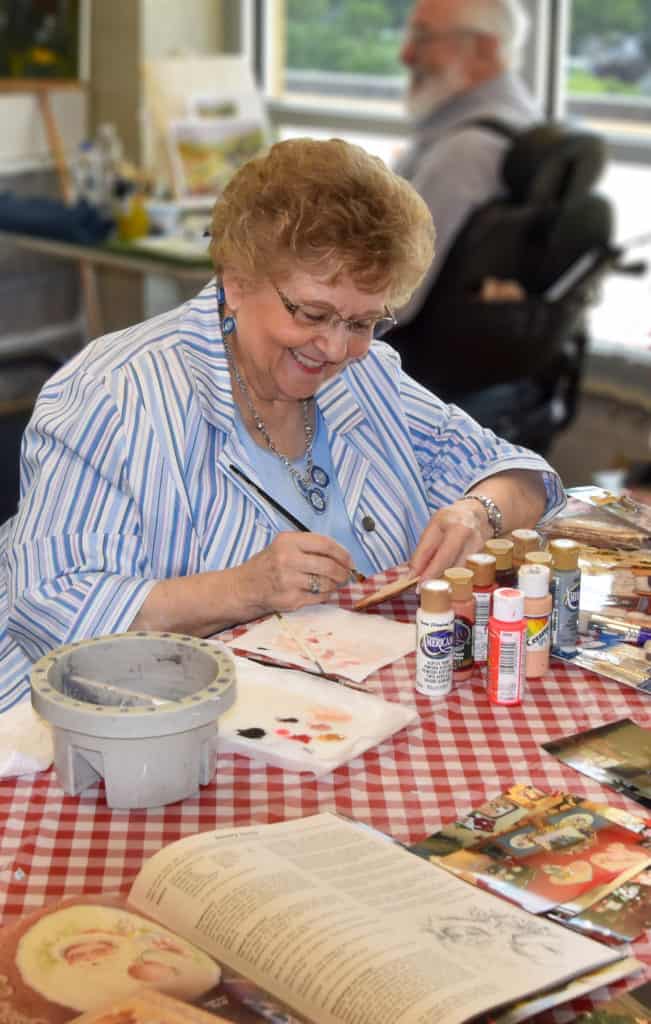 Resident making a craft